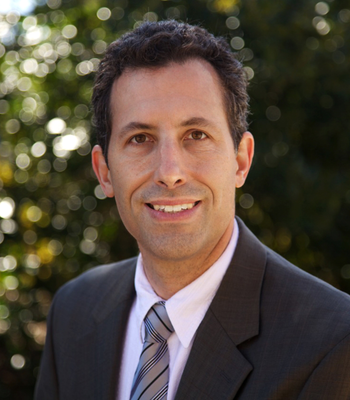 Portrait of Ivan Machiz, Realtor ®.